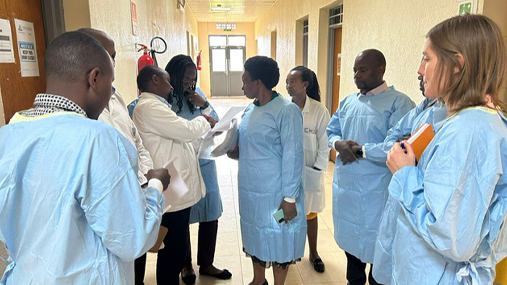 The CASPAR study team, representing Johnson & Johnson, tours the laboratories at the University Teaching Hospital of Butare, one of the participating sites in the CASPAR Study. Photo by Carla Decotelli-Mendes. (photo)